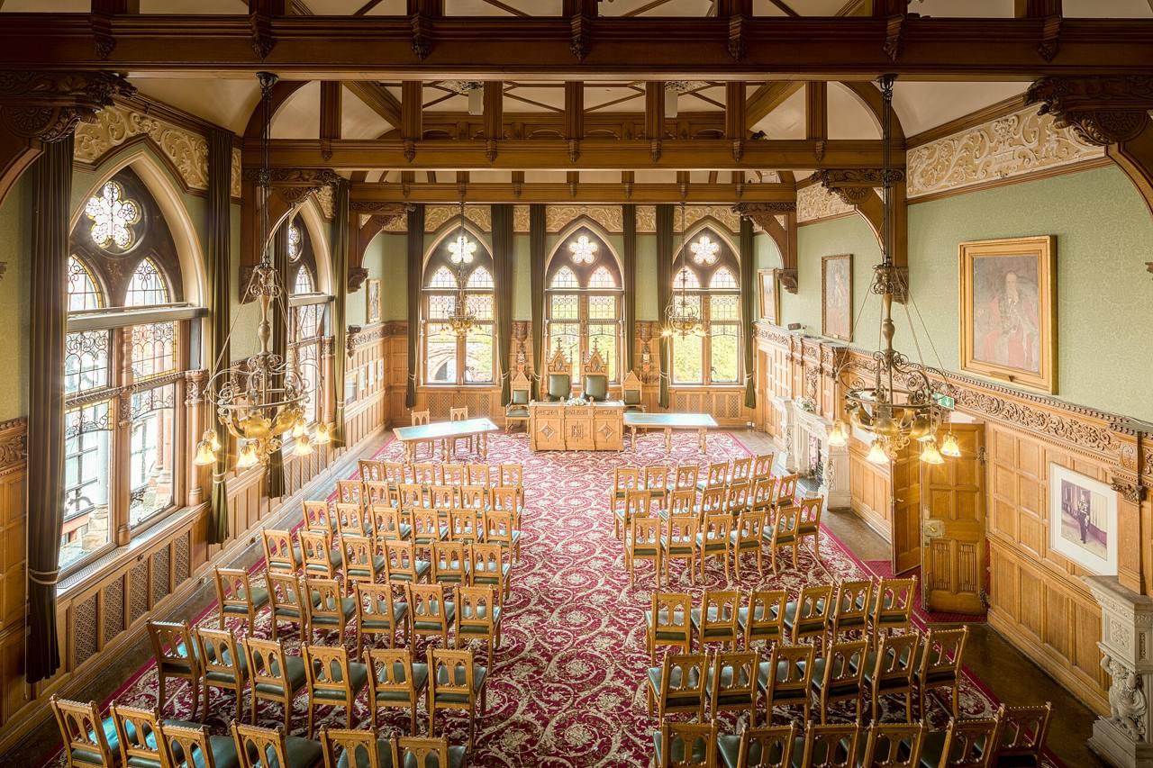 A council chamber with rows of chairs